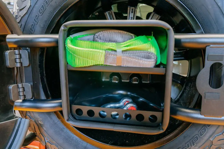Premium LETECH storage compartment integrated with a spare wheel holder, protecting recovery gear from the elements.