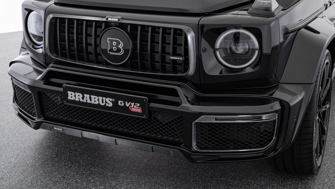 Luxury BRABUS Carbon Fiber Front Bumper Attachments for G-Class, featuring high-grade carbon fiber and integrated LED DRLs.