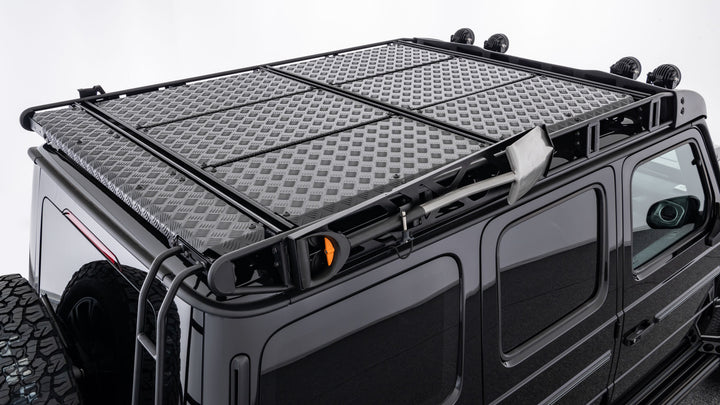 BRABUS Adventure Roof Rack installed on a Mercedes-Benz G-Class W463A, showcasing ample cargo space and rugged styling.