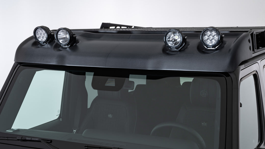 BRABUS Carbon Wind Deflector with four integrated LED headlamps, including high beams and work lights, designed for Mercedes G-Class W463A.