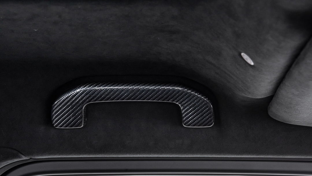 Luxury BRABUS Carbon Fiber Interior Upgrade for G-Class, featuring high-grade carbon fiber door handles and seamless integration.