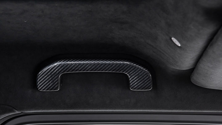 Luxury BRABUS Carbon Fiber Interior Upgrade for G-Class, featuring high-grade carbon fiber door handles and seamless integration.