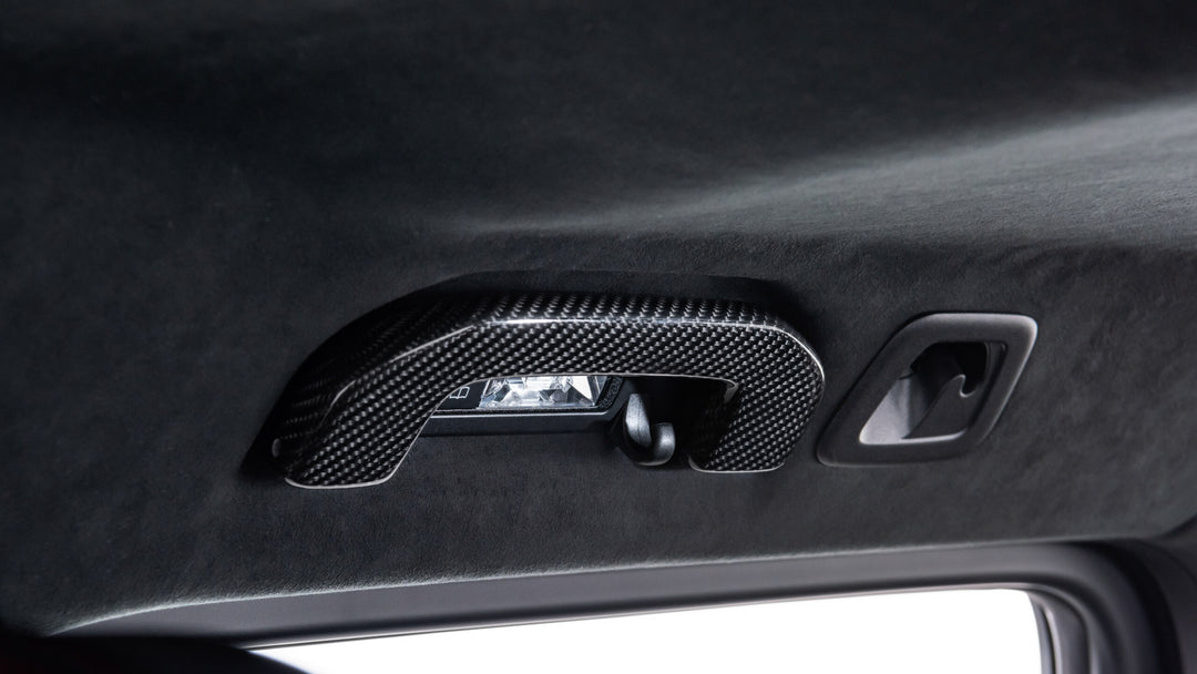 BRABUS Carbon Fiber Interior Door Handles for Mercedes-Benz G-Class W463A, showcasing enhanced interior styling and luxury