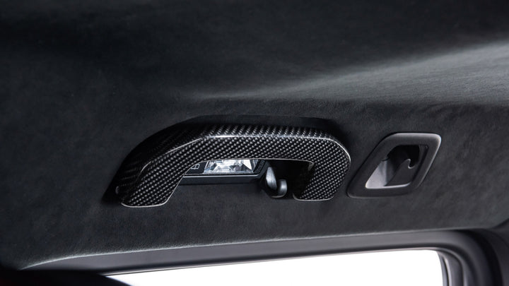 BRABUS Carbon Fiber Interior Door Handles for Mercedes-Benz G-Class W463A, showcasing enhanced interior styling and luxury