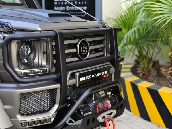 BRABUS Adventure Package Front Protection Bar installed on a Mercedes-Benz G-Class 4x4², showcasing its rugged design and enhanced front-end protection.