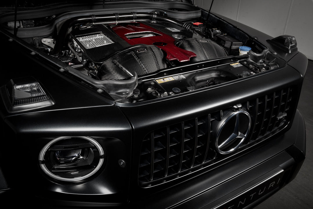 The Eventuri Carbon Fiber Intake System delivers dyno-proven performance gains and an exhilarating driving experience for your Mercedes-Benz G63 AMG installed shot from the left 