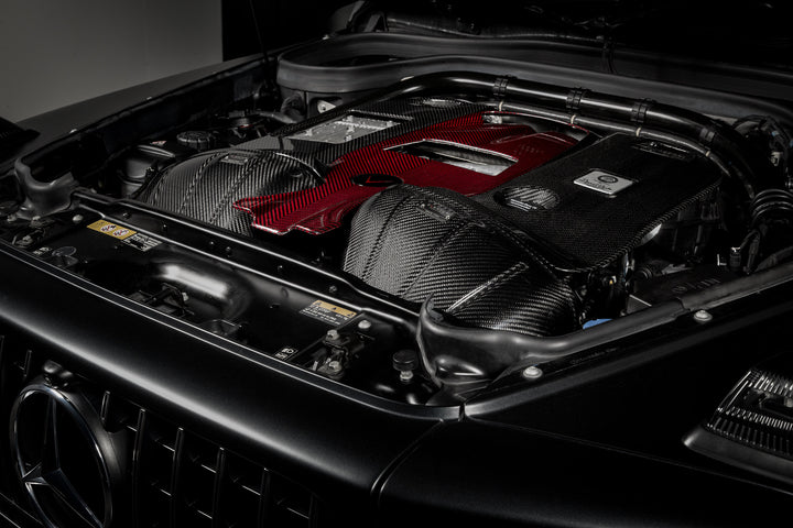The Eventuri Carbon Fiber Intake System delivers dyno-proven performance gains and an exhilarating driving experience for your Mercedes-Benz G63 AMG installed shot from the right 