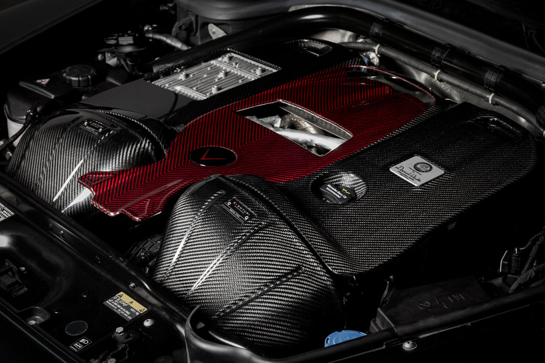 The Eventuri Carbon Fiber Intake System delivers dyno-proven performance gains and an exhilarating driving experience for your Mercedes-Benz G63 AMG installed close up shot from a right angle 