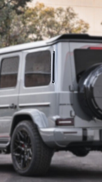 Urban Automotive carbon fiber C-pillar trims mounted on Mercedes-Benz G-Wagon, enhancing luxury exterior styling.
