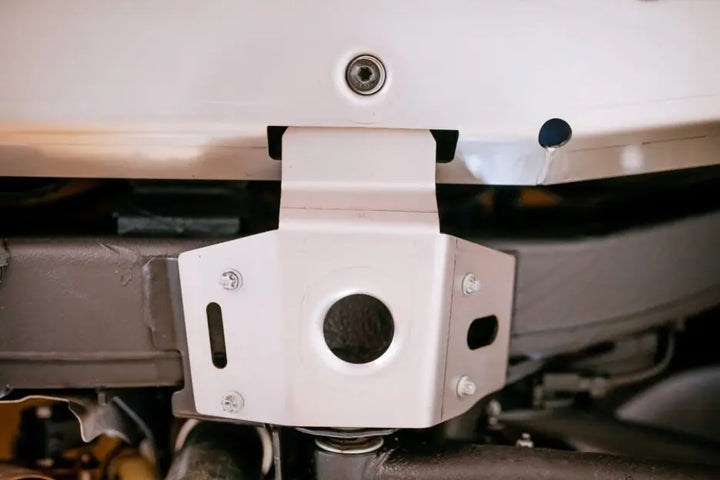 The LETECH Underride Guard System seamlessly integrated with the underbody of a G-Class, providing ultimate protection on rugged terrains.
