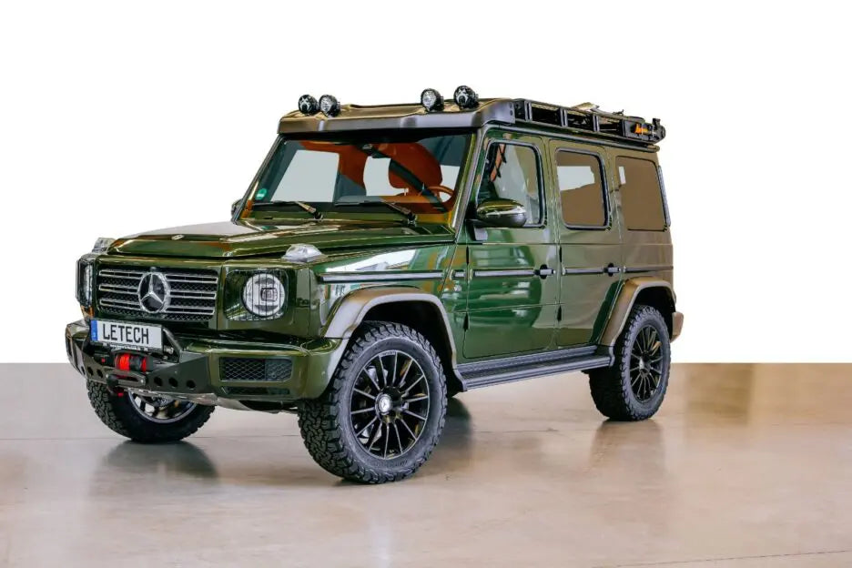 The durable and elegant LETECH Axe Holder, designed to seamlessly integrate with your G-Class and roof rack installed on green g-wagon
