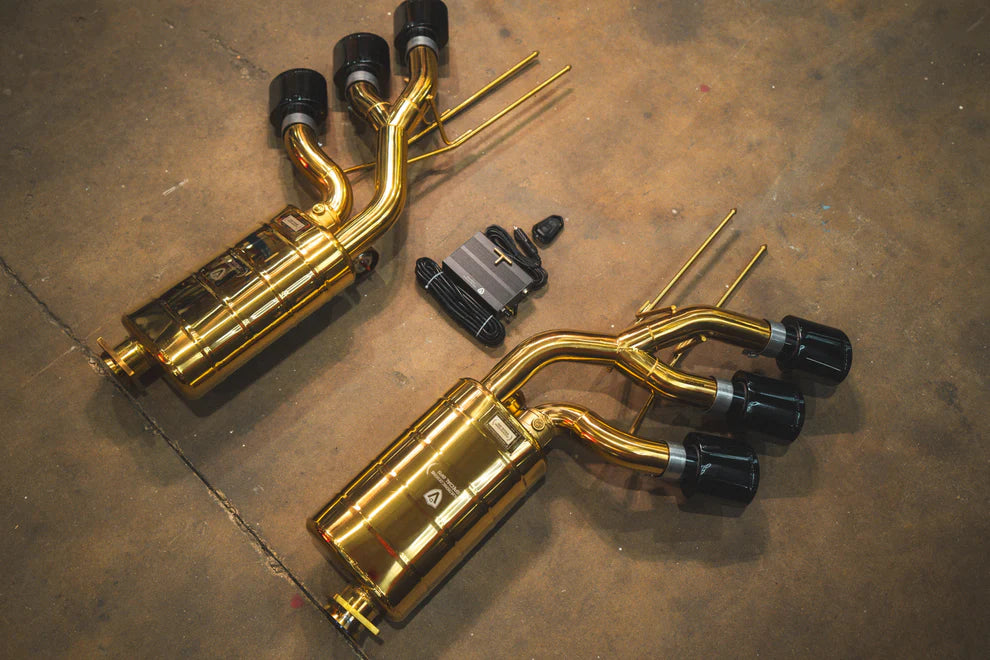 Valvetronic Designs valved exhaust system for Mercedes-AMG G63 W463 with black ceramic tips, showing aggressive dual-pipe design
