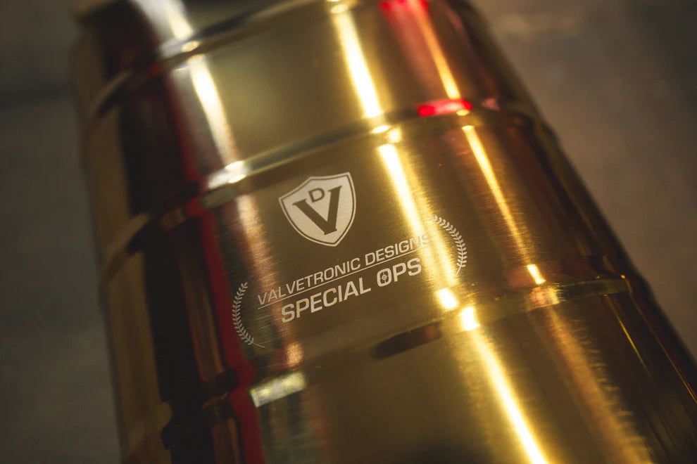 Close-up of Valvetronic exhaust's black ceramic tips with laser-etched branding on Mercedes G-Wagon