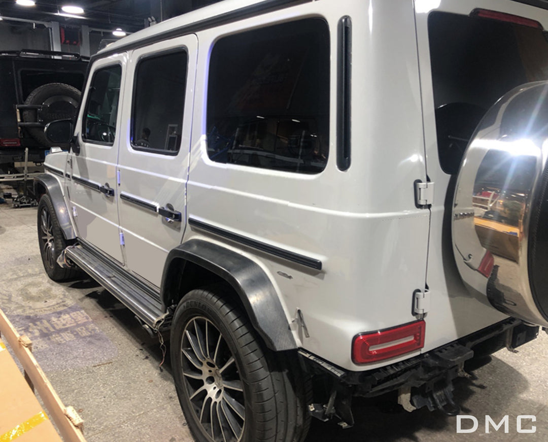 DMC Carbon Fiber Exterior Kit installed on white AMG G63 W464

