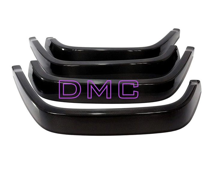 Close-up of pre-preg carbon weave on DMC fender flares laid out on a white background