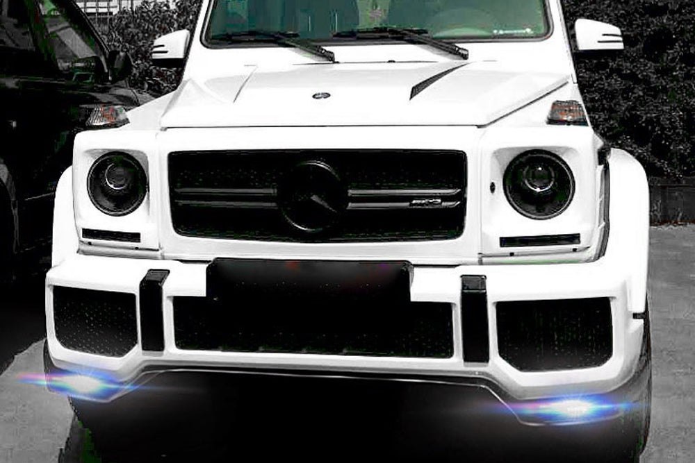 DMC Carbon Fiber LED Front Lip installed on white Mercedes-AMG G63 W463 with the light on showing brightness