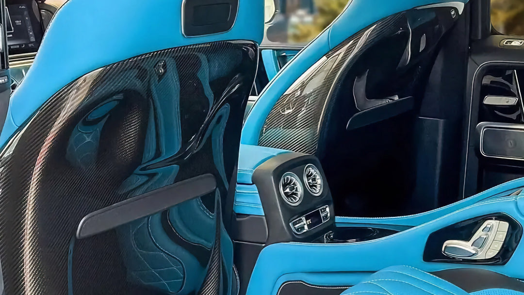 Close-up of DMC carbon fiber backrest cover weave for G63 W464, lightweight and scratch-resistant installed in G0-wagon with custom blue interior