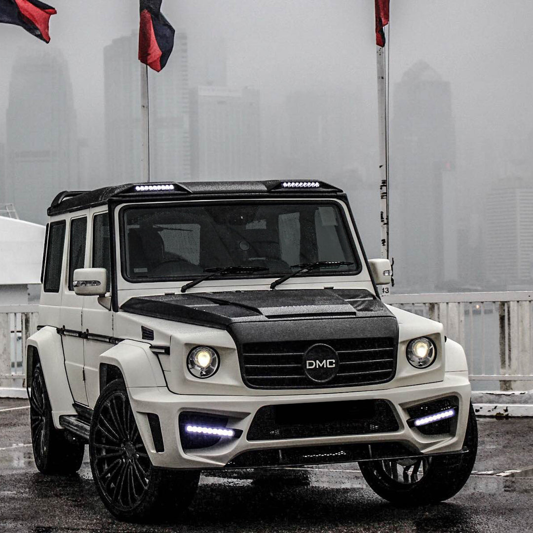 Installed DMC forged carbon fiber hood on Mercedes-AMG G63 W463 - aggressive styling upgrade with vacuum-infused construction