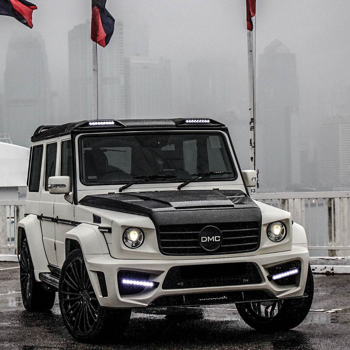 Installed DMC forged carbon fiber hood on Mercedes-AMG G63 W463 - aggressive styling upgrade with vacuum-infused construction