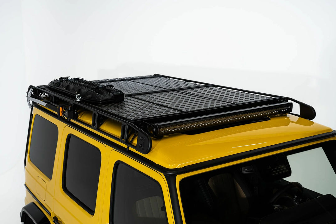 The stylish and functional LETECH Shovel Holder Quickmount for secure tool transport installed onto roof rack on a yellow g-wagon