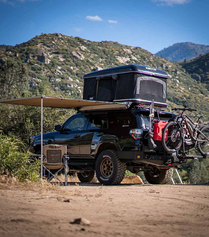 Mercedes G-Wagon with GOBI Stealth Rack and ARB awning deployed, demonstrating wind-resistant stability in off-road conditions