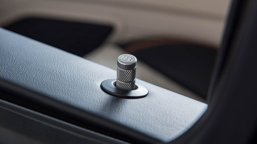 Enhance your Mercedes-Benz interior with BRABUS Aluminum Door-Lock Pins. Premium design, lightweight construction, and subtle luxury.