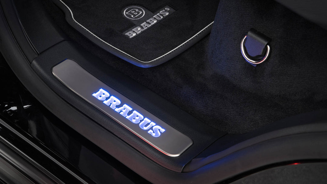 BRABUS Scuff Plates with RGB-LED illumination featuring 64 customizable colors and the iconic BRABUS logo for Mercedes G-Class W463A
