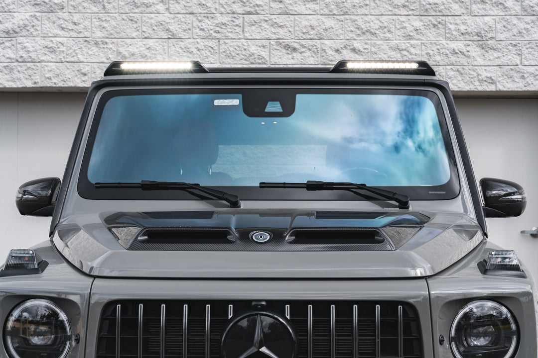 Urban Automotive roof light cluster illuminating off-road terrain at night - high-intensity LED beams for Mercedes G-Wagon W463