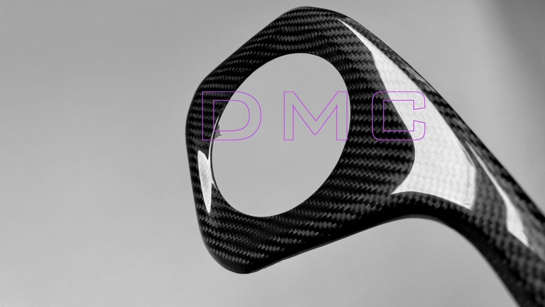 Handcrafted forged carbon fiber weave on DMC dashboard trim for G63 AMG - lightweight TUV-certified material close up shot of the ring portion that goes around the air vent 