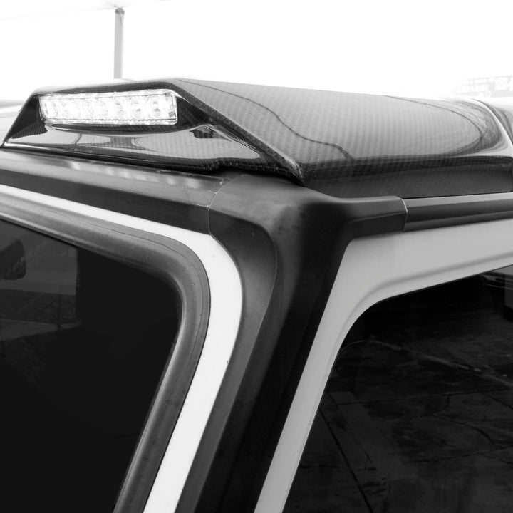 Aerodynamic DMC Zeus roof light - maintains G-Class silhouette while adding 120° beam pattern
