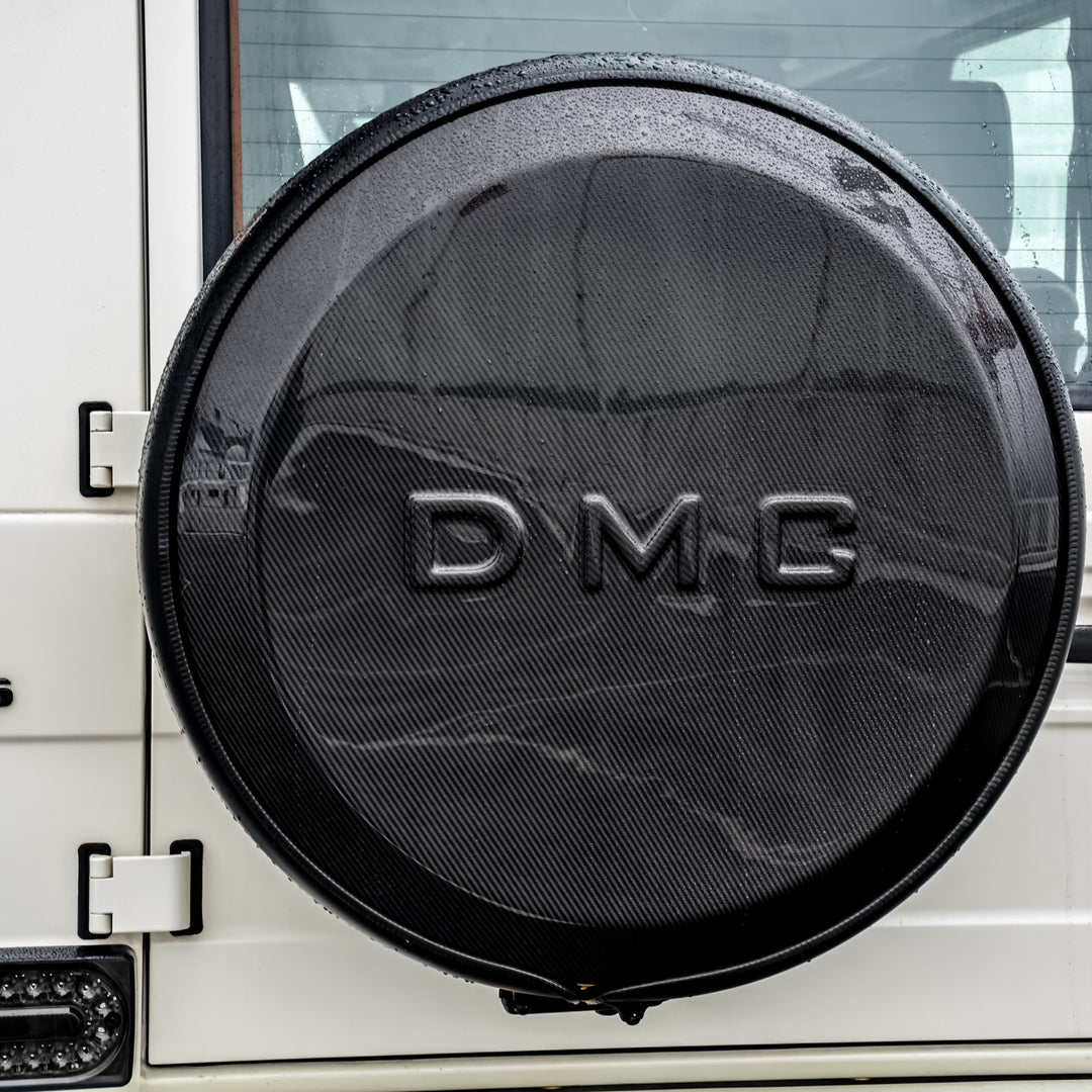 Side profile of Mercedes-AMG G63 with DMC carbon fiber spare wheel cover installed