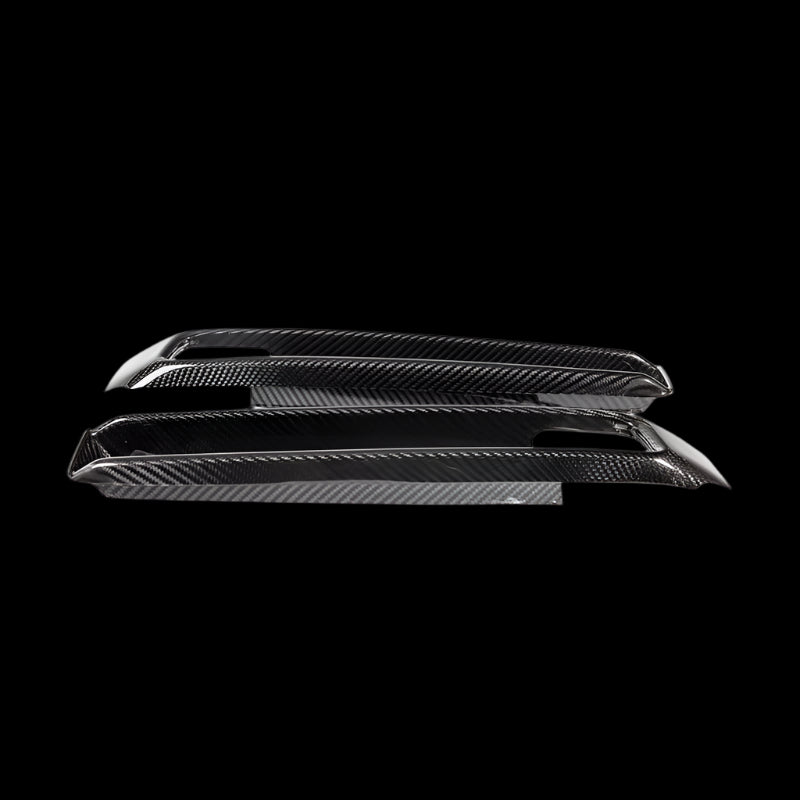 Urban Automotive carbon fiber bumper intake trims for Mercedes G-Class W463A, featuring high-gloss forged carbon weave and precision OEM fitment (2019+).