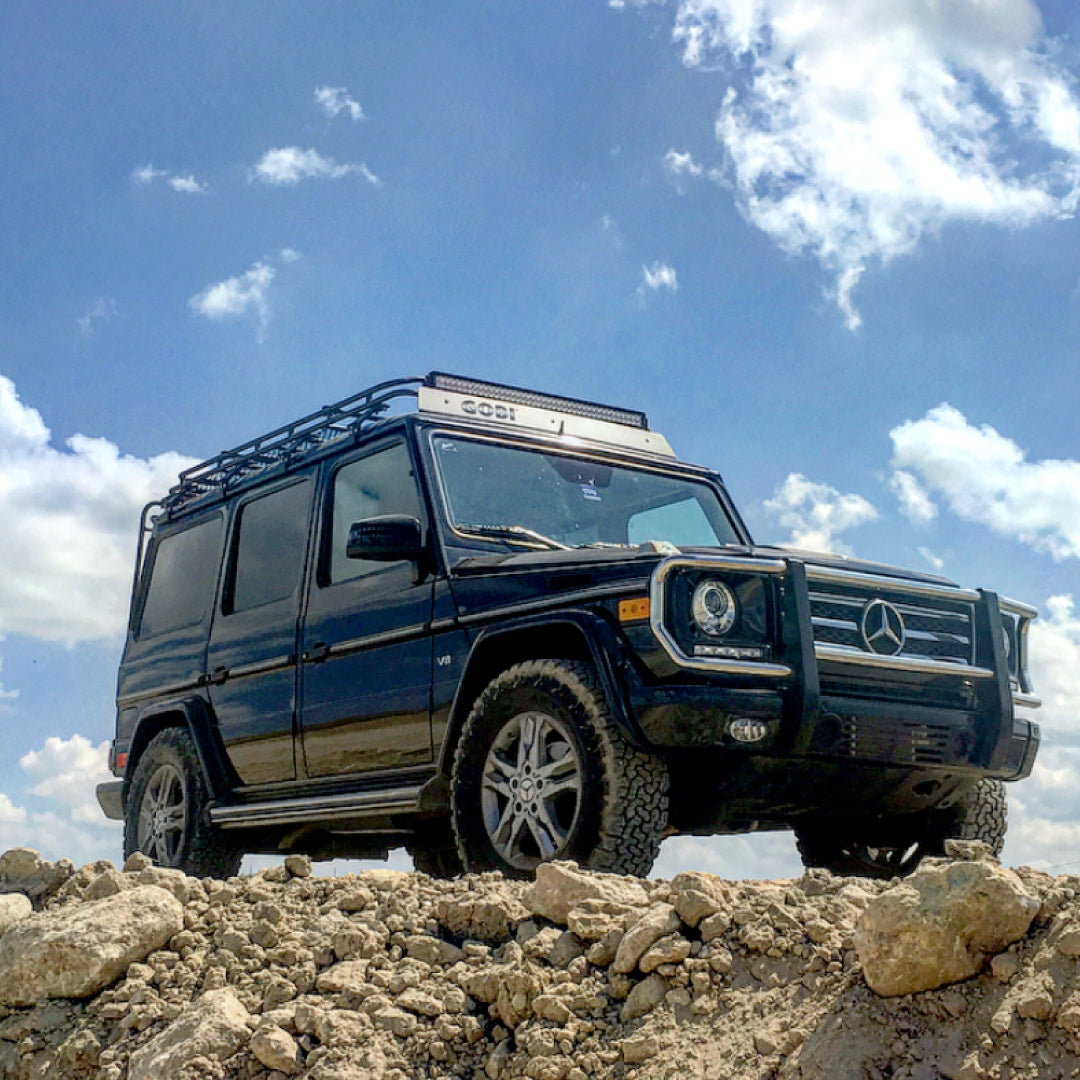 GOBI Stealth Rack installed on Mercedes G-Wagon (no sunroof), showcasing low-profile design and integrated lightbar mounts front view, low angle 