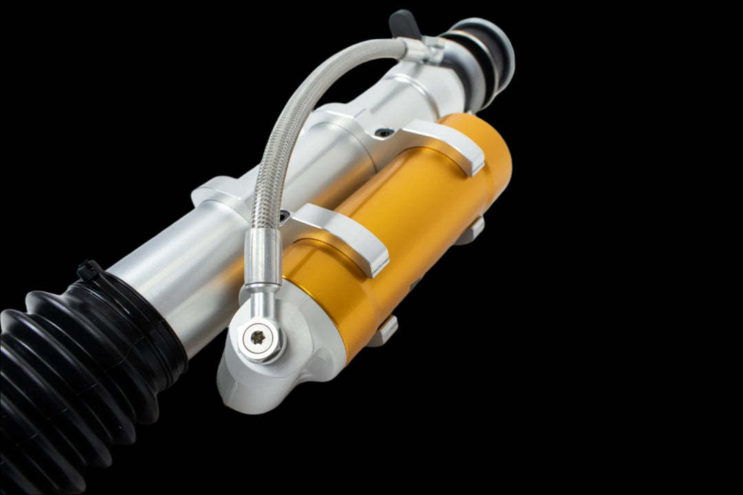 Luxury-grade RENNtech suspension components for Mercedes G-Class, emphasizing precision adjustment dials and durable materials.