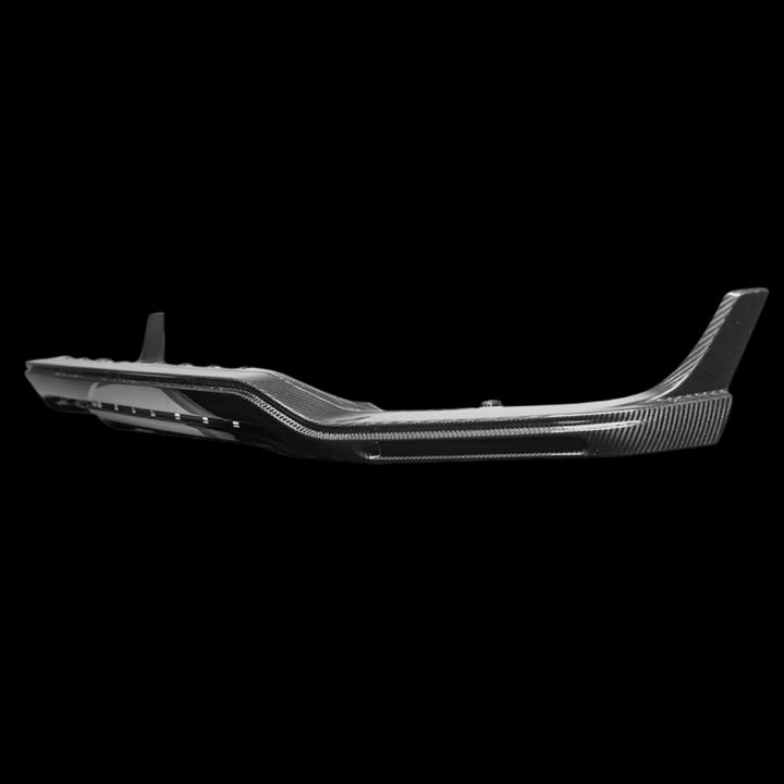 Urban Automotive OEM-style carbon fiber front bumper splitter for Mercedes-AMG G-Class (W463), featuring high-gloss forged weave and direct bolt-on fitment (2019+)