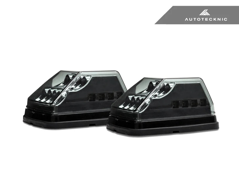 side view Close-up of AutoTecknic smoked lens housing for G-Class turn signals - modern blackout finish complements carbon fiber mirror caps