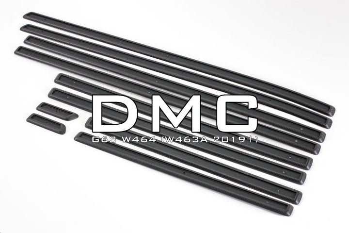 DMC Carbon fiber tirm kit for g-wagon laid out on a white background