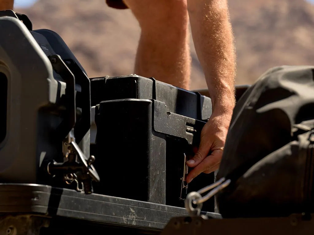 Front Runner Wolf Pack Pro Rack Mounting Bracket / MKII securely holding a Wolf Pack Pro container on a Slimline II roof rack.