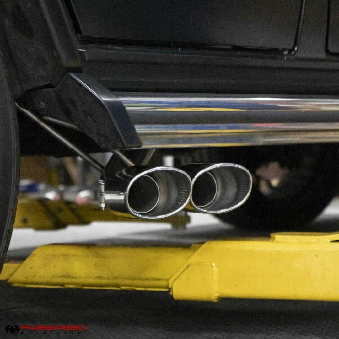Fabspeed Maxflo cat-back exhaust installed on Mercedes-AMG G63 (W463), highlighting OEM-fit bolt-on design with dual Maxflo resonators external view showing polished tips