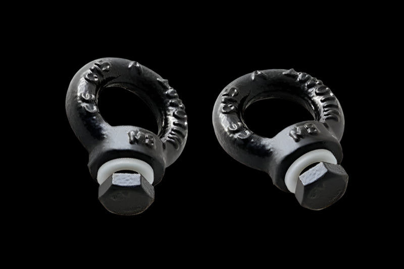 Pair of Front Runner Black Tie Down Rings mounted on a Slimline II Roof Rack, creating secure cargo attachment points