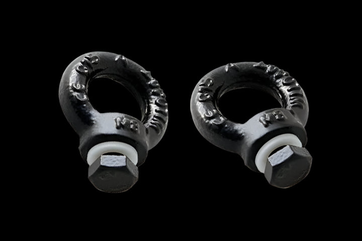 Pair of Front Runner Black Tie Down Rings mounted on a Slimline II Roof Rack, creating secure cargo attachment points