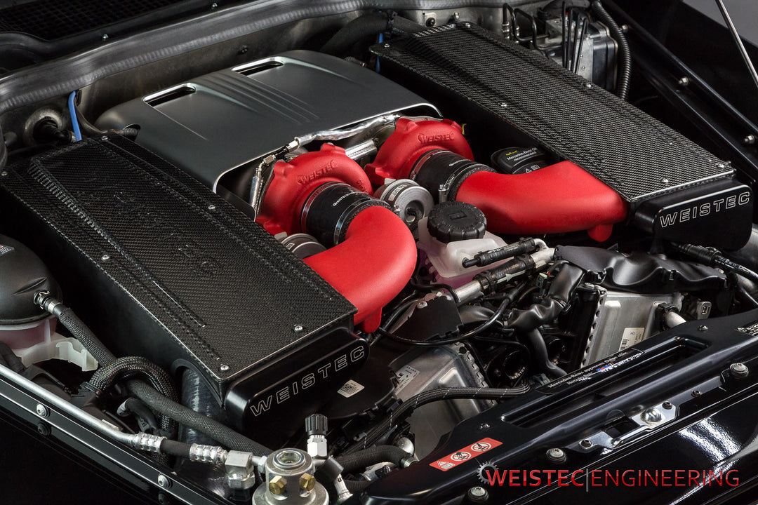 Engine bay view of Mercedes G550 with installed Weistec carbon fiber airboxes, highlighting increased airflow and luxury finish.