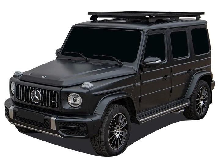 Side view of the Front Runner Slimline II Roof Rack on a G-Wagon, highlighting low-profile aerodynamic wind deflector and sturdy foot rails.