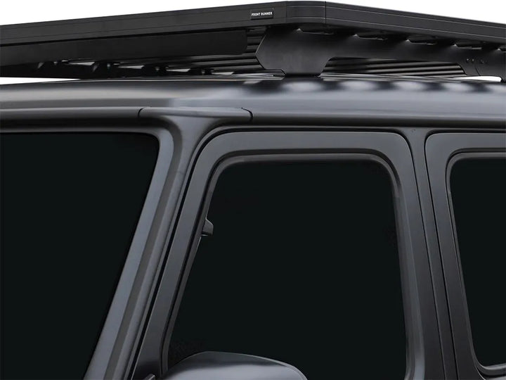 Front Runner Slimline II Roof Rack installed on a Mercedes G-Class 4-door, showcasing sleek black powder-coated aluminum construction and modular design.