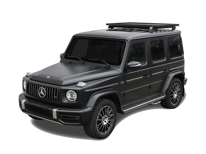 Mercedes-Benz G-Class with Front Runner Slimline II 1/2 Roof Rack Kit, highlighting modular cargo tray and rugged construction.