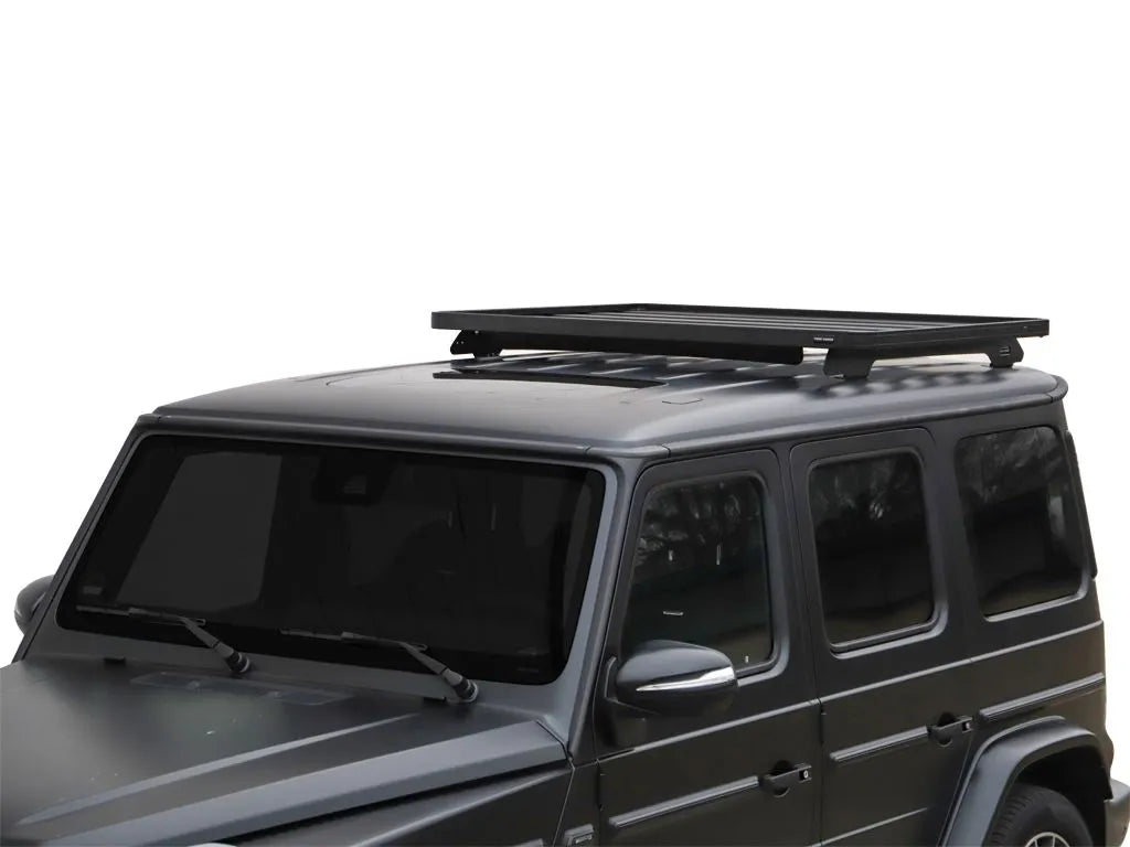 Close-up view of Slimline II 1/2 Roof Rack Kit mounted on G-Wagon, displaying premium aluminum and stainless steel materials.