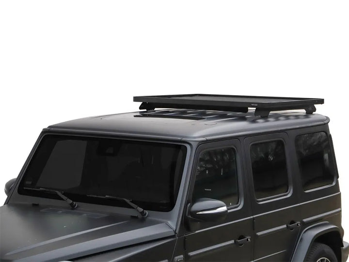 Close-up view of Slimline II 1/2 Roof Rack Kit mounted on G-Wagon, displaying premium aluminum and stainless steel materials.