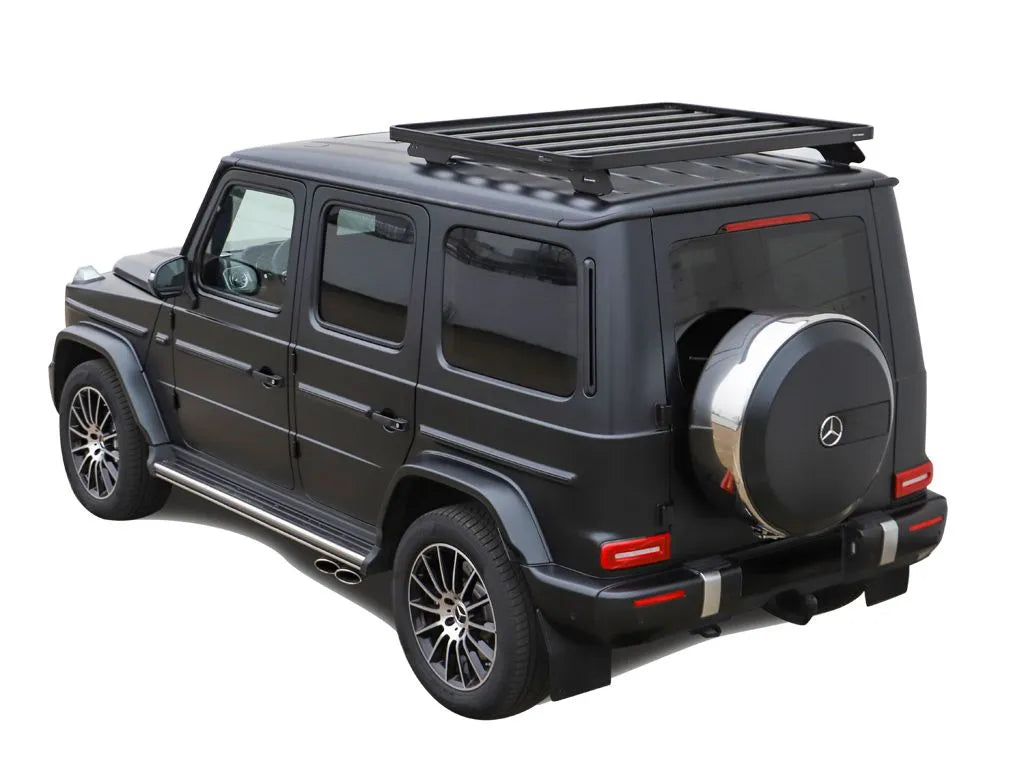 Side profile of Mercedes G-Class featuring Front Runner roof rack kit, emphasizing aerodynamic wind deflector and luxury styling.