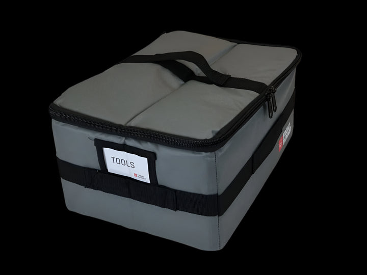 Front Runner Flat Pack packed with camping supplies, demonstrating efficient cargo management in vehicle setups