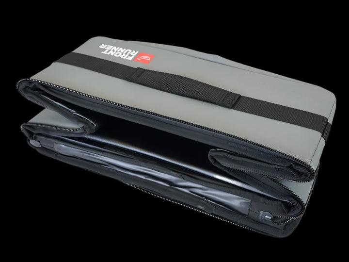 Flat Pack by Front Runner folded flat, highlighting its compact and space-saving design for vehicle organization